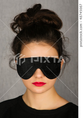 Gorgeous woman with black sleep mask - Image Gorgeous woman with black sleep mask - Image 48745087
