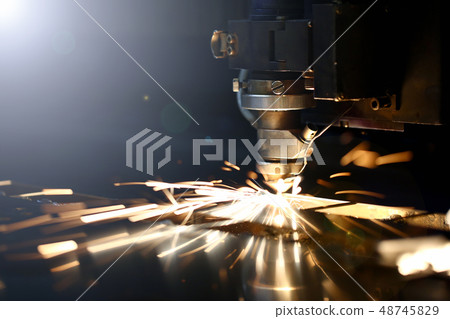 Sparks fly out machine head for metal processing 48745829