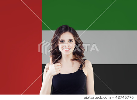 Happy woman student with thumb up on the UAE flag 48746776