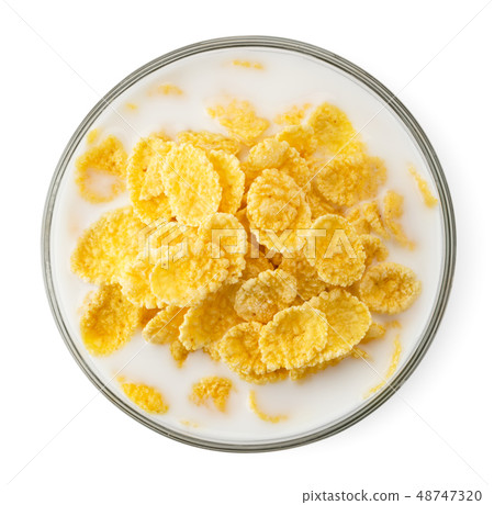 Cornflakes with milk in a plate on a white. The 48747320