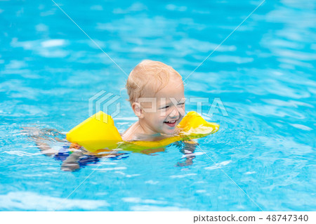 Baby in swimming pool. Kids swim. Baby in swimming pool. Kids swim. 48747340