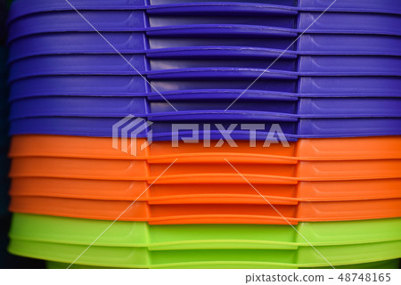 Colored plastic baskets for housewives in store Colored plastic baskets for housewives in store 48748165