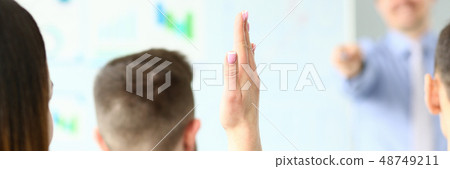 Female hand is raised up in hall for an Female hand is raised up in hall for an 48749211