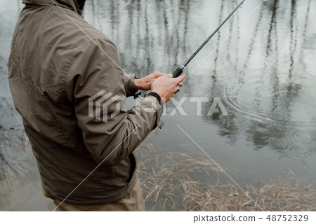 Young man is fishing Young man is fishing 48752329