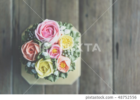 Cake cream is sweet dessert on wooden table Cake cream is sweet dessert on wooden table 48752556