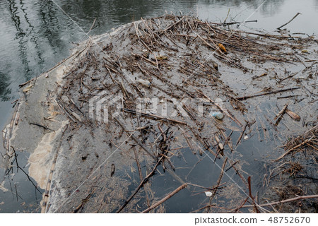 Garbage floating in water Garbage floating in water 48752670