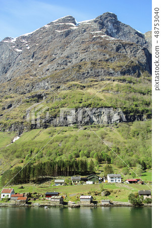 Norwegian fjord landscape under the steep cliff picturesque small town Norwegian fjord landscape under the steep cliff picturesque small town 48753040