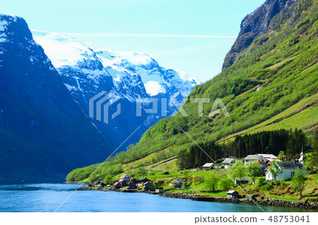 Norwegian fjord landscape under the steep cliff picturesque small town Norwegian fjord landscape under the steep cliff picturesque small town 48753041