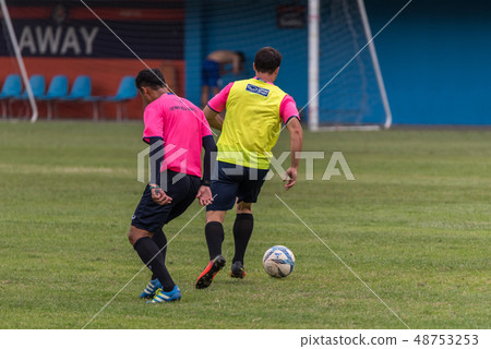Football player in a game at football stadium 48753253