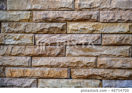 Old brown stone bricks wall pattern background of 48754708