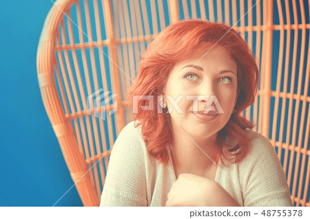 Woman dreaming in the chair Woman dreaming in the chair 48755378