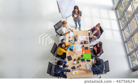 Top view scene of Asian and Multiethnic Business people with casual suit sitting and Fist Bumping Corporate Colleagues Teamwork with happy action in the modern workplace, people business group concept Top view scene of Asian and Multiethnic Business people with casual suit sitting and Fist Bumping Corporate Colleagues Teamwork with happy action in the modern workplace, people business group concept 48756624