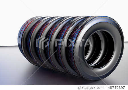 New winter tires with a modern tread on the black background. 48759897