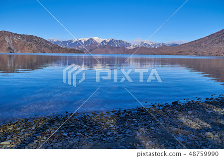 Mountains from the south bank of Nikko Chuzenji Lake to the northwest of the remaining snow Mountains from the south bank of Nikko Chuzenji Lake to the northwest of the remaining snow 48759990