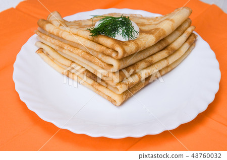 a stack of Russian pancakes a stack of Russian pancakes 48760032