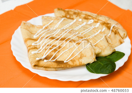 a stack of Russian pancakes 48760033