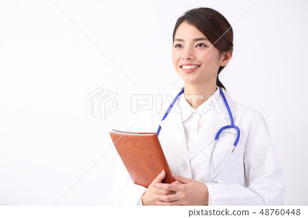 A woman in a white coat A woman in a white coat 48760448