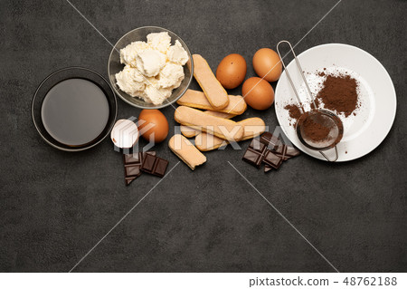 Ingredients for cooking tiramisu - Savoiardi biscuit cookies, mascarpone, cream, sugar, cocoa Ingredients for cooking tiramisu - Savoiardi biscuit cookies, mascarpone, cream, sugar, cocoa 48762188