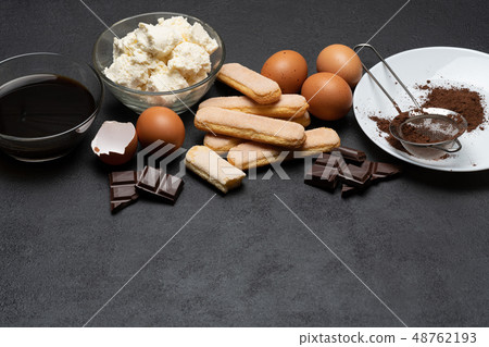 Ingredients for cooking tiramisu - Savoiardi biscuit cookies, mascarpone, cream, sugar, cocoa 48762193
