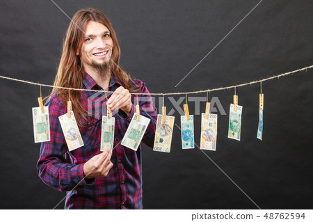 Rich man with laundry of money 48762594