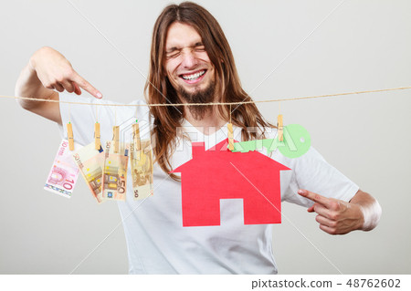 Man seller with money and house Man seller with money and house 48762602