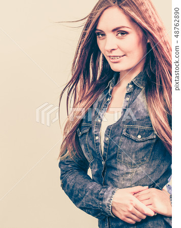 Focused girl wearing jeans. Focused girl wearing jeans. 48762890