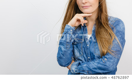 Beautiful young lady with denim jacket. 48762897