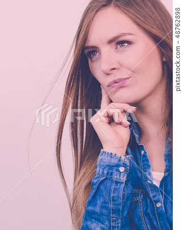 Pensively girl with blue shirt. 48762898