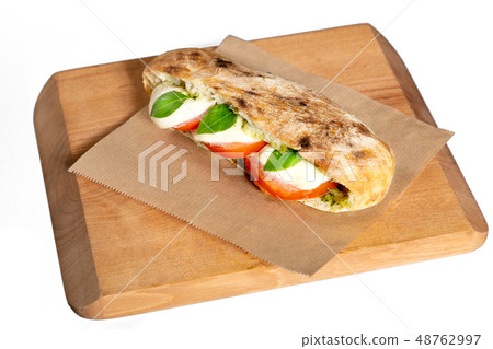 Pita bread with mozzarella cheese, tomato and 48762997