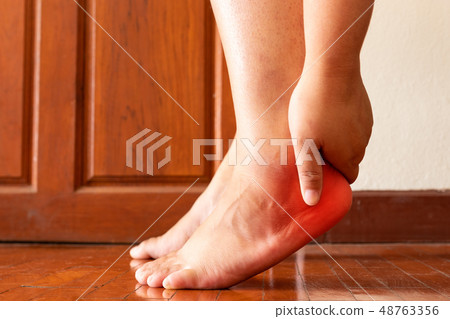 Female foot heel pain or plantar fasciitis. Health 48763356