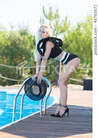 Sexy bikini body woman sun tanning relaxing Sexy bikini body woman sun tanning relaxing 48765671