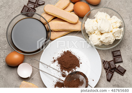 Ingredients for cooking tiramisu - Savoiardi biscuit cookies, mascarpone, cream, sugar, cocoa Ingredients for cooking tiramisu - Savoiardi biscuit cookies, mascarpone, cream, sugar, cocoa 48765680