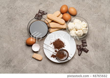 Ingredients for cooking tiramisu - Savoiardi biscuit cookies, mascarpone, cream, sugar, cocoa Ingredients for cooking tiramisu - Savoiardi biscuit cookies, mascarpone, cream, sugar, cocoa 48765682