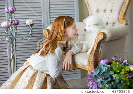 Portrait of ginger hair girl play with husky poppy 48765806