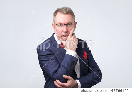Senior european man in blue suit and glasses 48766131