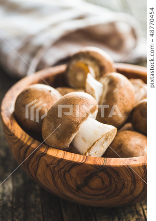 Fresh champignon mushrooms. Fresh champignon mushrooms. 48770454