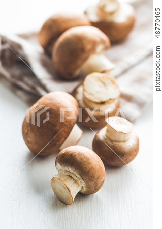 Fresh champignon mushrooms. Fresh champignon mushrooms. 48770465