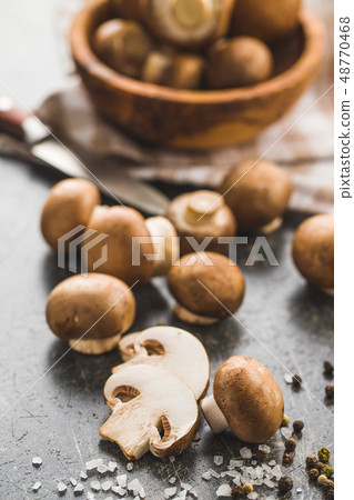 Fresh champignon mushrooms. Fresh champignon mushrooms. 48770468