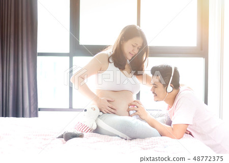 Asian pregnant woman with husband. Mother day and Asian pregnant woman with husband. Mother day and 48772375