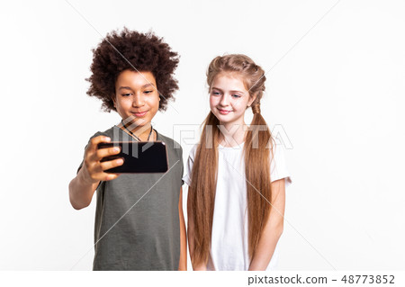 Pretty young kids making selfie together on smartphone 48773852