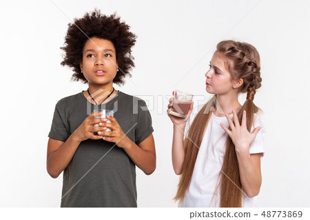 Communicative young lady telling interesting story to her friend 48773869