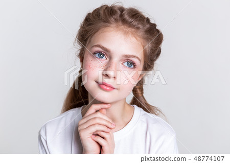 Pleasant sinless little child looking up with her big eyes 48774107