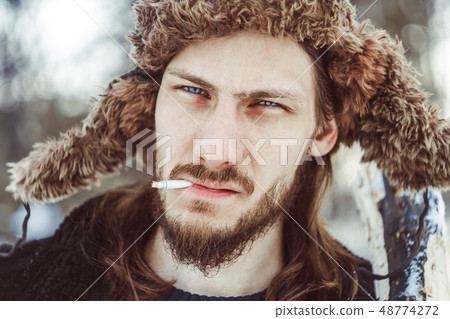 the man in the hat with earflaps the man in the hat with earflaps 48774272