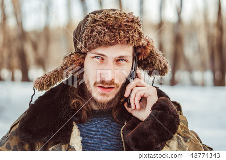 the man in the hat with earflaps the man in the hat with earflaps 48774343