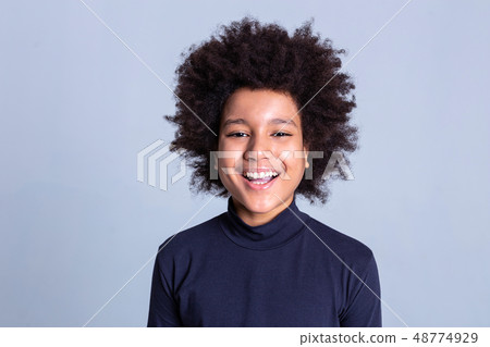 Dark-haired African American little person being extremely happy during photoshoot Dark-haired African American little person being extremely happy during photoshoot 48774929