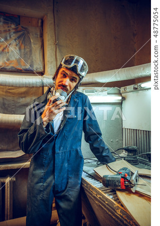 Portrait of serious professional carpenter Portrait of serious professional carpenter 48775054