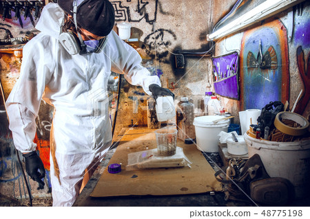 Master painter in a factory 48775198