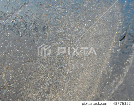 Shining piece of ice agains to spring Sun. Lake 48776332