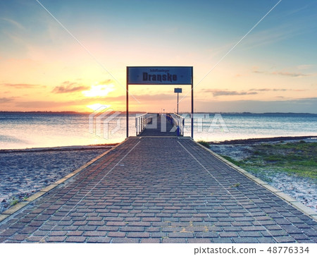 View of wooden pier or dock in sea. Perspective View of wooden pier or dock in sea. Perspective 48776334