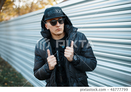 Handsome guy in a stylish black dress  48777799